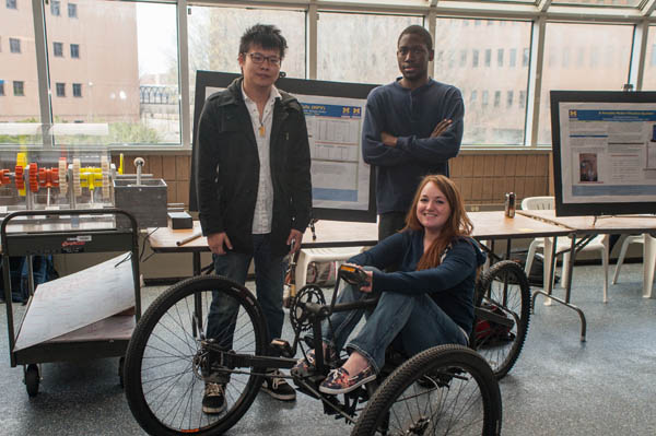 Members of the Human Powered Vehicle group pose with the UM-Flint Engineering Senior Design Project