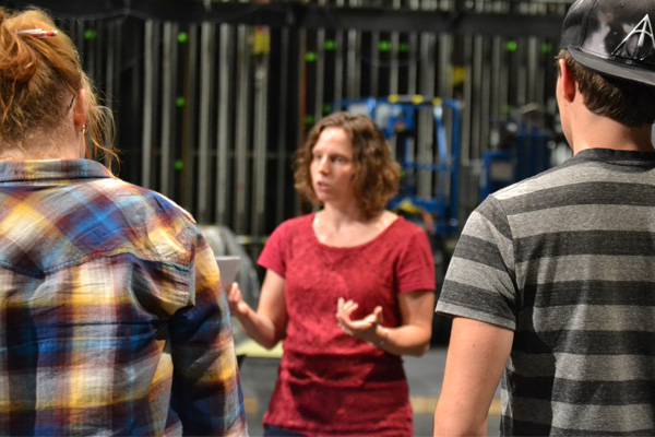 UM-Flint Theatre's Stephanie Dean talks with cast members during a rehearsal of "Next to Normal."