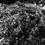 Eyeglasses taken from prisoners at Auschwitz concentration camp.  From the collection of Yad Vashem photo archive.