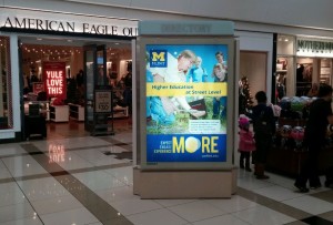 Lighted shopping mall display featuring UM-Flint's civic engagement courses