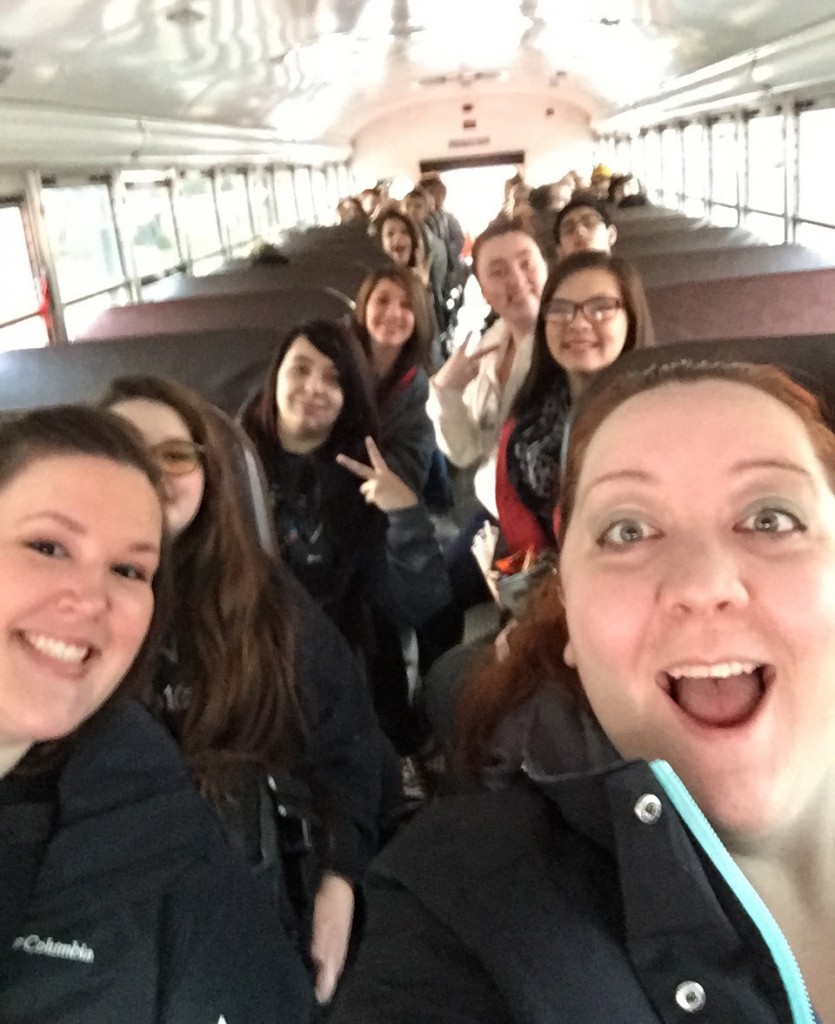 Tiffani Hurley, student teacher, and her Economic Impact group on the bus to their next destination