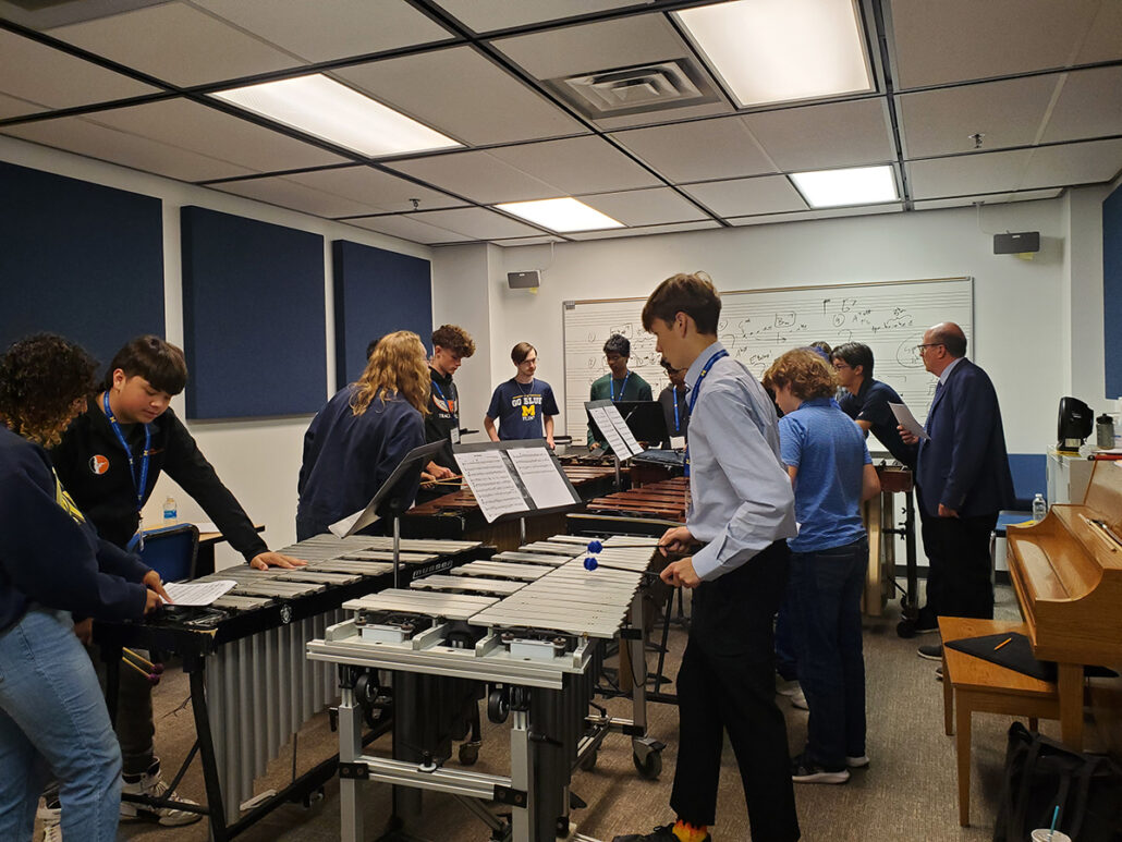 UM-Flint Music instructor teaches percussion students in a classroom