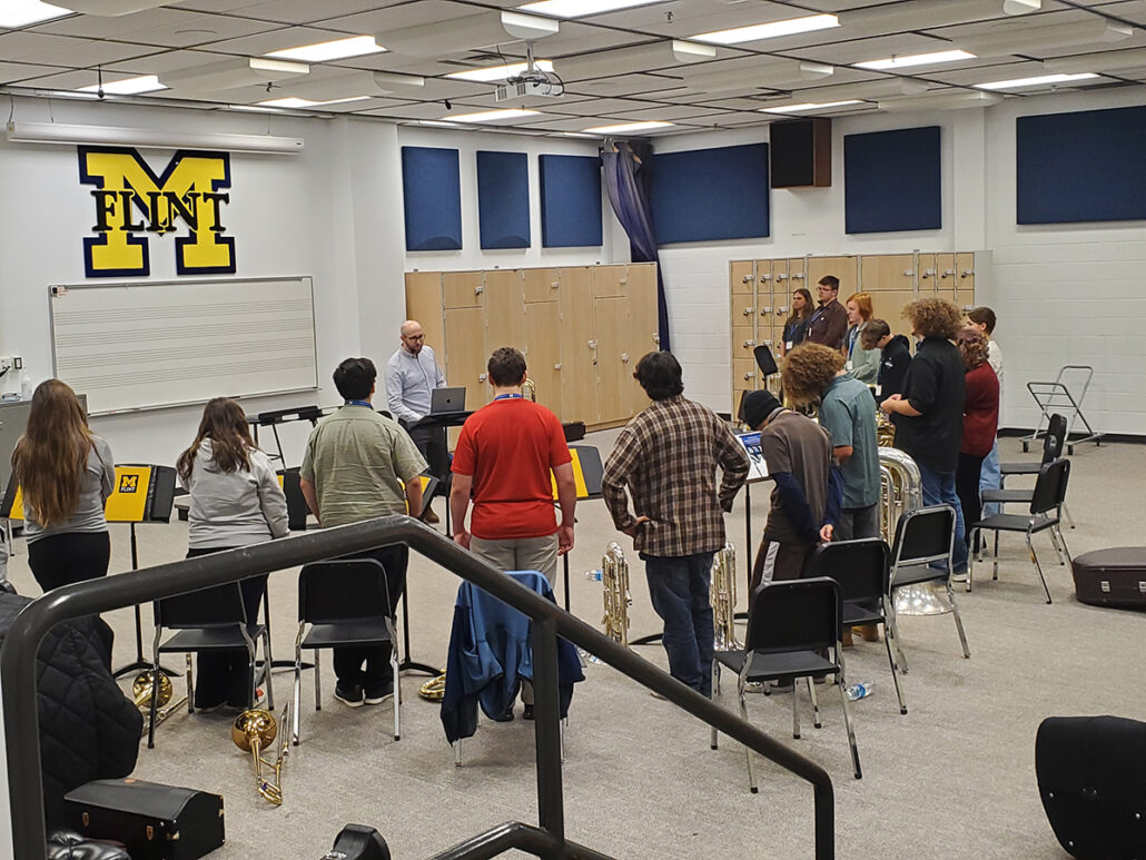 UM-Flint music instructor teaching low brass high school music students in a classroom