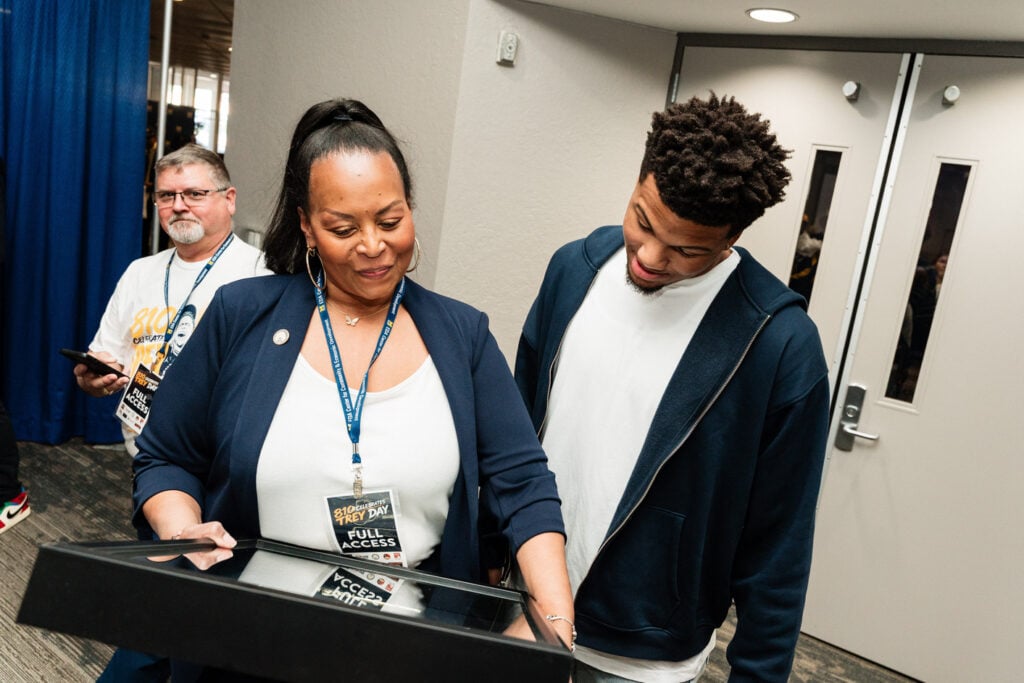 Flint native Trey McKenney celebrates with community members during Trey Day in Flint, Michigan, honoring his recent national championship win with Michigan Wolverines men's basketball on May 14, 2026.