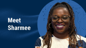A person with glasses smiles against a blue background, with the text "Meet Sharmee" prominently displayed.