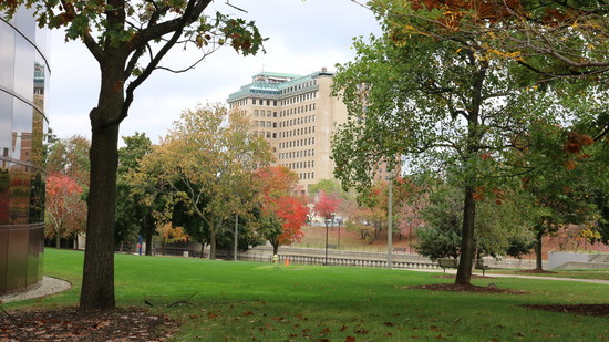Long distance view of the Northbank center from the Library through the fall trees
